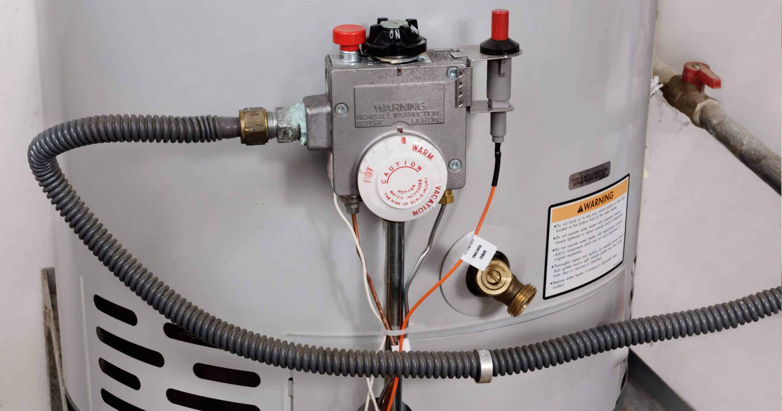 What causes too much pressure in a hot water heater?