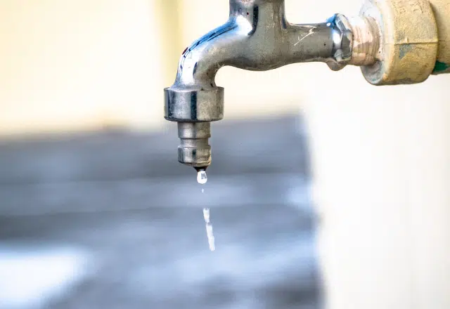 Close-up of a dripping outdoor faucet, symbolizing the need for plumbing repairs, which Sacramento plumbers are equipped to handle