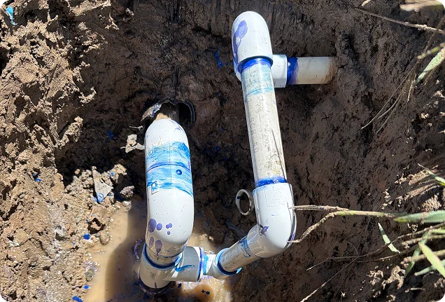 Repaired underground water pipes laid in a trench outside a Roseville residential property.