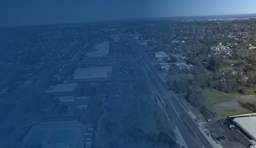 Aerial drone view of residential neighborhoods and streets in Citrus Heights, CA.